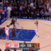A basketball player in a white and orange uniform shoots a jump shot with 5.6 seconds left in the 4th quarter, Hawks leading Knicks 107-106.
