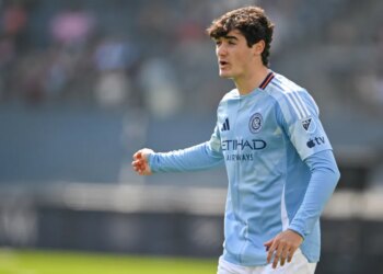 A New York City FC player in a light blue jersey.