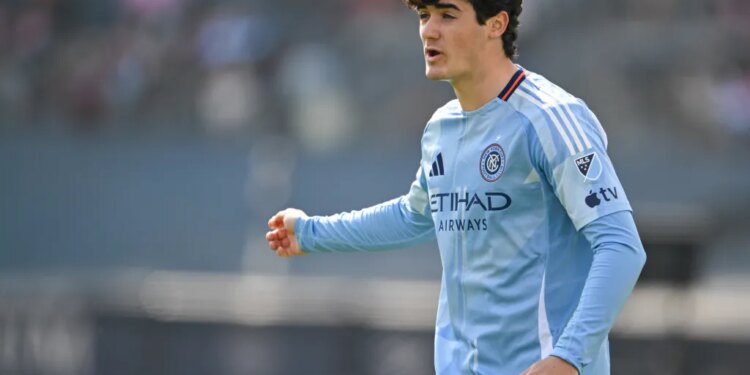 A New York City FC player in a light blue jersey.