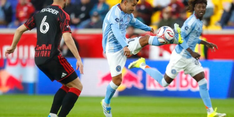 Maxi Moralez, who had three assists, makes a play as Robert Voloder defends during the first half of NYCFC's 3-1 win over the Red Bulls on April 29, 2026 in Harrison, N.J.
