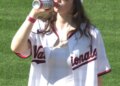 Nationals fan Sorcha Lewis celebrates her 21st birthday with a ceremonial "first sip" of beer on the mound on April 4, 2026.