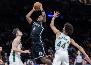 E.J. Liddell, who scored a game-high 21 points, shoots over AJ Green (20) and Andre Jackson Jr. (44) during the Nets' 96-90 win over the Bucks on April 7, 2026 at Barclays Center.