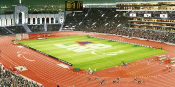 Illustration of a stadium at night, with the LA 2028 and Paralympic logos on the field and track.
