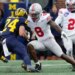 Ohio State Buckeyes linebacker Arvell Reese (8) tackling Michigan Wolverines running back Bryson Kuzdzal (24).