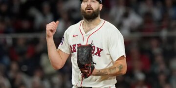 Boston Red Sox pitcher Lucas Giolito reacts after striking out Athletics Lawrence Butler.