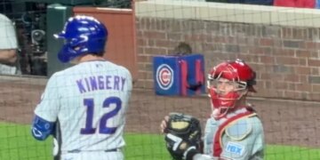 A rat sits on top of a Cubs ball bag near the Phillies dugout on April 21, 2026.