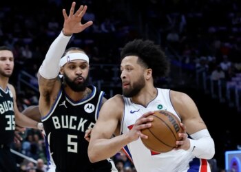 Returning star guard Cade Cunningham drives on Milwaukee's Gary Trent Jr. during the Piston-Bucks game on April 8, 2026 in Detroit.