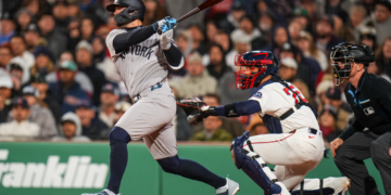 Randal Grichuk rips an RBI double in the eighth inning of the Yankees' 4-0 win over the Red Sox on April 21, 2026 at Fenway Park.