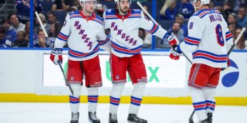 Mika Zibanejad (center) celebrates with Alexis Lafrenière (left) and J.T. Miller after scoring a second-period goal during the Rangers' 4-2 win over the Lightning on April 15, 2026 at Benchmark International Arena.
