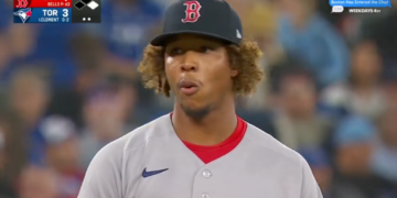A baseball player, Brayan Bello, standing on the field. Boston 1, Toronto 3.