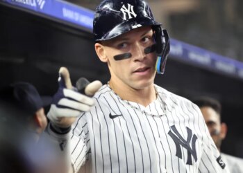 New York Yankees right fielder Aaron Judge #99 reacts in the dugout after he scores on his solo home run during the 6th inning.