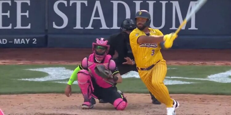 Russell Wilson hits a ground ball for the Savannah Bananas at Yankee Stadium on April 26, 2026.