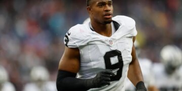 Football player wearing a white jersey with the number 9.