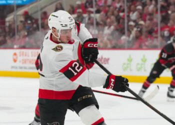 Ottawa Senators center Shane Pinto (12) takes a shot against the Carolina Hurricanes during the second period.