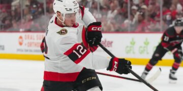 Ottawa Senators center Shane Pinto (12) takes a shot against the Carolina Hurricanes during the second period.