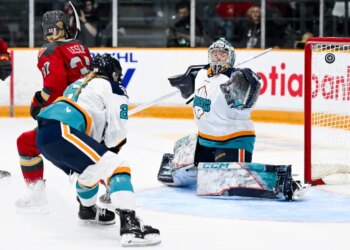 Ottawa's Rebecca Leslie (37) scores on Kayle Osborne during the first period of the Sirens' 5-1 road loss to the Charge on April 18, 2026.
