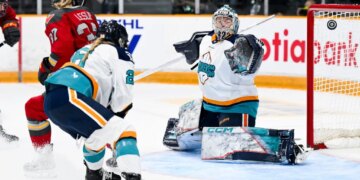 Ottawa's Rebecca Leslie (37) scores on Kayle Osborne during the first period of the Sirens' 5-1 road loss to the Charge on April 18, 2026.