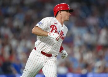 Philadelphia Phillies catcher JT Realmuto (10) runs to first after hitting a single against the Chicago Cubs in the fourth inning at Citizens Bank Park.