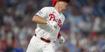 Philadelphia Phillies catcher JT Realmuto (10) runs to first after hitting a single against the Chicago Cubs in the fourth inning at Citizens Bank Park.