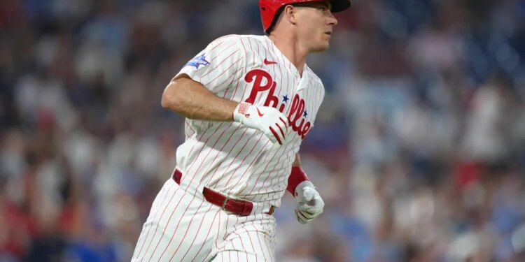 Philadelphia Phillies catcher JT Realmuto (10) runs to first after hitting a single against the Chicago Cubs in the fourth inning at Citizens Bank Park.