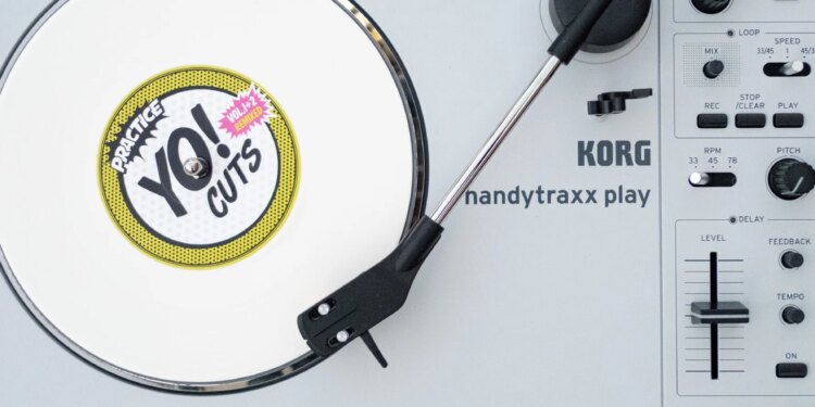 The Korg Handytraxx Play portable turntable on a beat up piece of deck furniture.