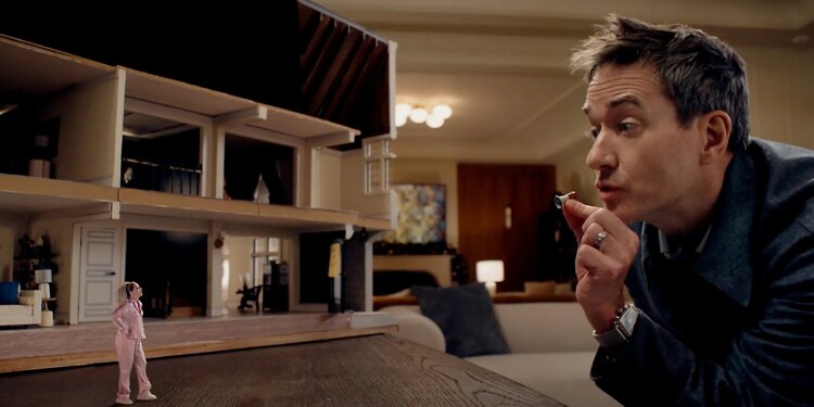 A tiny woman standing next to a bisected dollhouse as she has an argument with a gigantic man the size of a mountain.