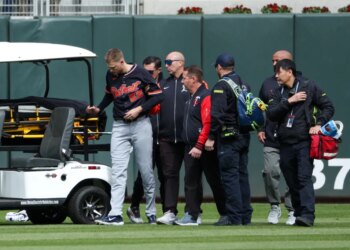 Tigers center fielder Parker Meadows is helped off the field after a collision with left fielder Riley Greene during the eighth inning of baseball game against the Minnesota Twins, Thursday, April 9, 2026, in Minneapolis.
