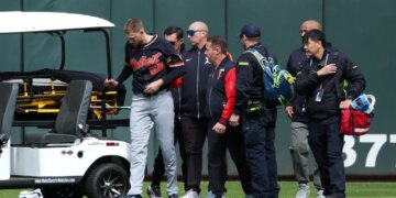 Tigers center fielder Parker Meadows is helped off the field after a collision with left fielder Riley Greene during the eighth inning of baseball game against the Minnesota Twins, Thursday, April 9, 2026, in Minneapolis.