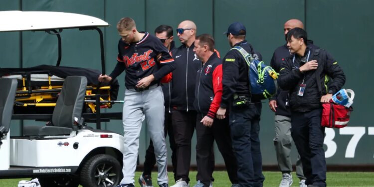 Tigers center fielder Parker Meadows is helped off the field after a collision with left fielder Riley Greene during the eighth inning of baseball game against the Minnesota Twins, Thursday, April 9, 2026, in Minneapolis.
