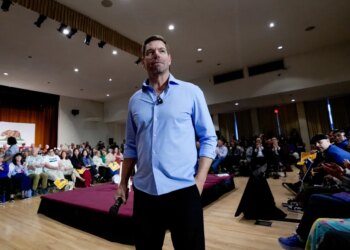 Rep. Eric Swalwell addresses an audience at a town hall meeting.