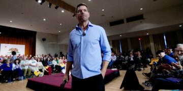 Rep. Eric Swalwell addresses an audience at a town hall meeting.