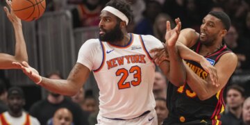 Michael Bradley (left) defends Mitchell Robinson during the Knicks' win over the Hawks on April 6, 2026 at the Garden.