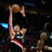 Portland Trail Blazers center Donovan Clingan (23) grabs a rebound during the second half against the Dallas Mavericks at Moda Center.