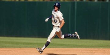 Payton Brennan running on the baseball field.