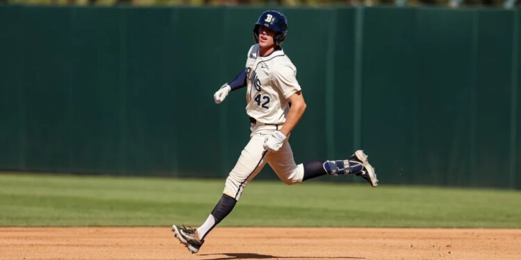 Payton Brennan running on the baseball field.