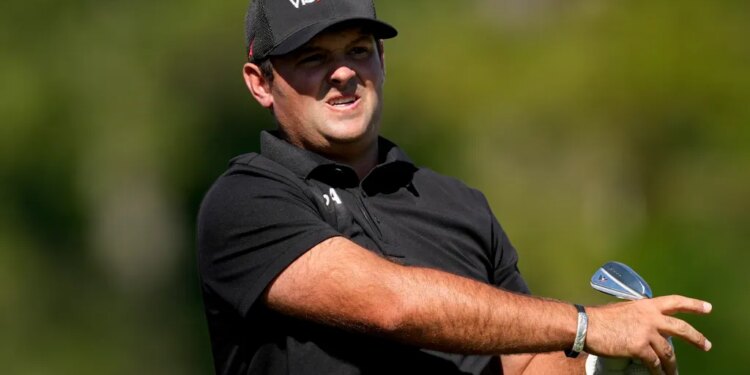 Patrick Reed watches his tee shot on the 12th hole during the second round of the Masters golf tournament at the Augusta National Golf Club.