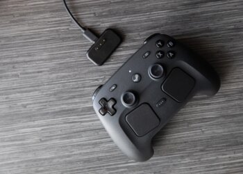 The Controller and the included puck for charging and connecting.