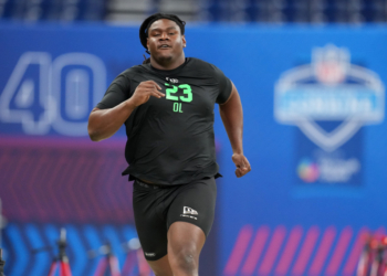 Kentucky offensive lineman Jalen Farmer (OL23) runs a drill at the NFL Scouting Combine.