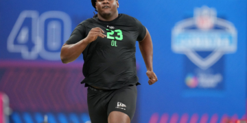 Kentucky offensive lineman Jalen Farmer (OL23) runs a drill at the NFL Scouting Combine.