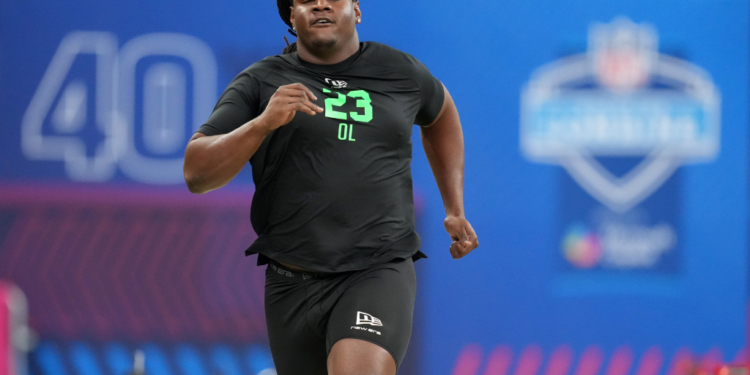 Kentucky offensive lineman Jalen Farmer (OL23) runs a drill at the NFL Scouting Combine.