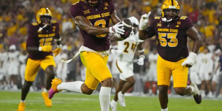 Arizona State wide receiver Jordyn Tyson scores a touchdown.