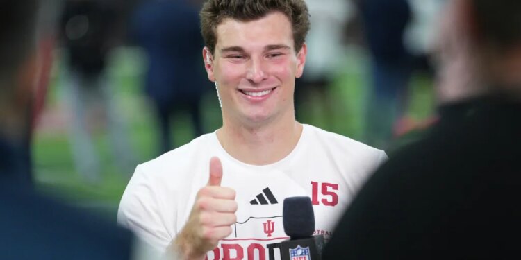 Fernando Mendoza gives a thumbs up during an interview with NFL Network.