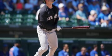 Yankees' Randal Grichuk watches the flight of his home run against the Chicago Cubs during the fourth inning of a spring training baseball game, Tuesday, March 24, 2026.
