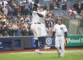 New York Yankees first baseman Ben Rice (22) celebrates with New York Yankees right fielder Aaron Judge (99) after he scores on his three-run homer.