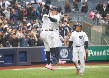 New York Yankees first baseman Ben Rice (22) celebrates with New York Yankees right fielder Aaron Judge (99) after he scores on his three-run homer.