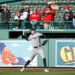 New York Yankees pitcher Cam Schlittler warms up on the field during batting practice.