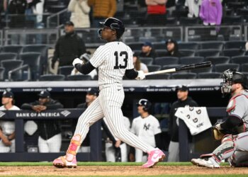 Yankees second baseman Jazz Chisholm Jr. (13) hits a two-run RBI double during the 9th inning of the Yankees and Miami Marlins game at Yankee Stadium.