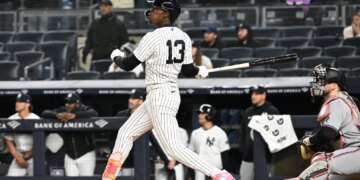 Yankees second baseman Jazz Chisholm Jr. (13) hits a two-run RBI double during the 9th inning of the Yankees and Miami Marlins game at Yankee Stadium.