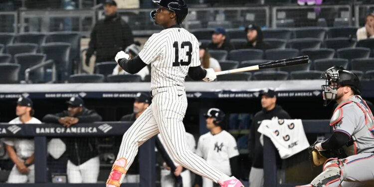 Yankees second baseman Jazz Chisholm Jr. (13) hits a two-run RBI double during the 9th inning of the Yankees and Miami Marlins game at Yankee Stadium.