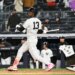 Yankees second baseman Jazz Chisholm Jr. (13) hits a two-run RBI double during the 9th inning of the Yankees and Miami Marlins game at Yankee Stadium.
